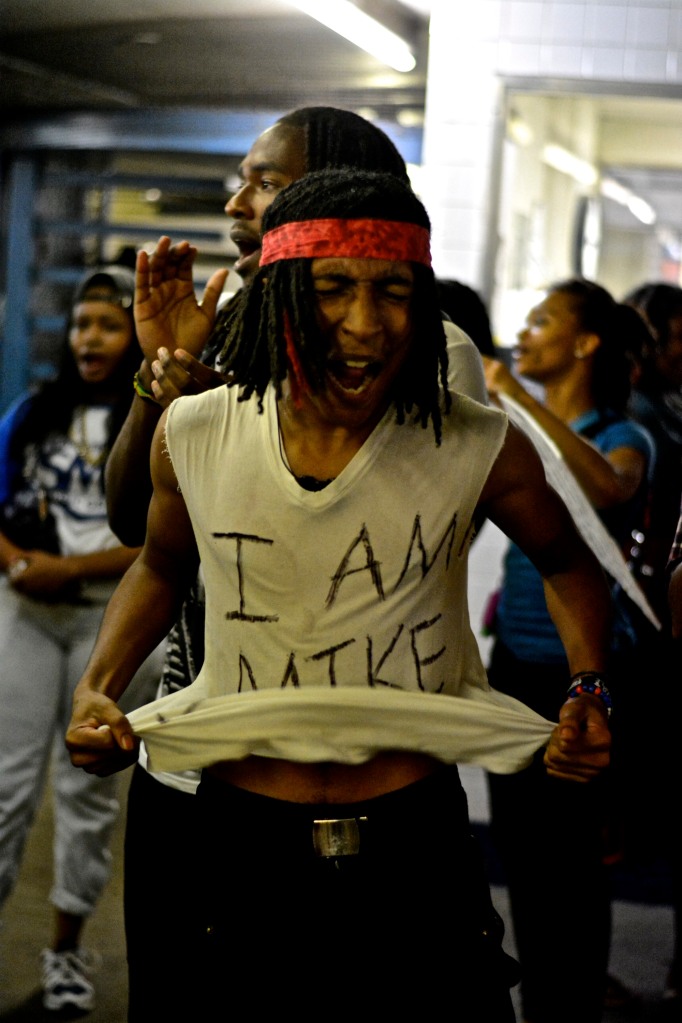 A protester passionaltey yells " I am Mike Brown." ( Photo By Joshua Albert)